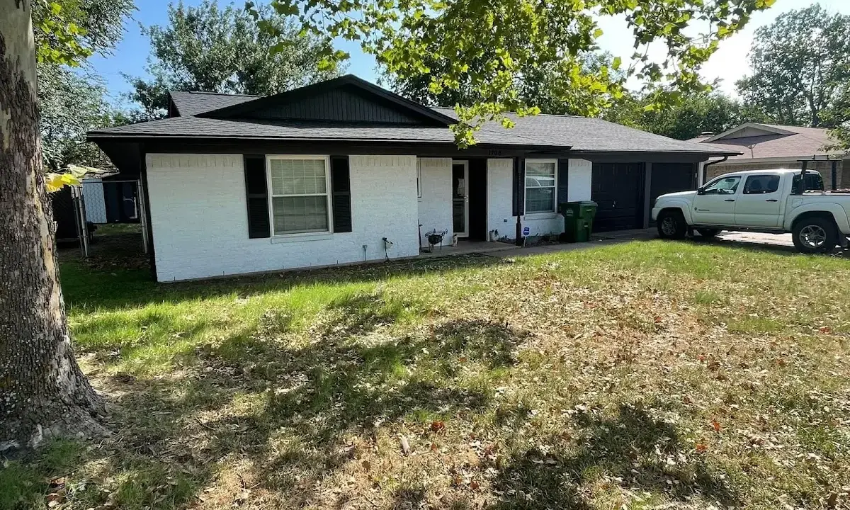 Professional roofing crew working on a residential roof in Walkertown